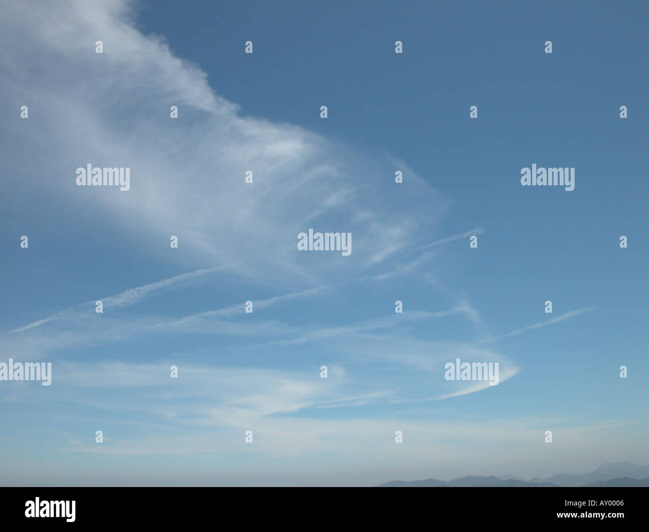 a restful sky with whispy clouds and glimpse of horizon Stock Photo