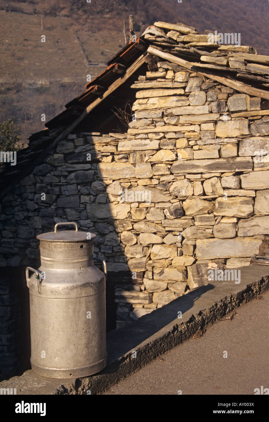 milk canister outside cattleshed awaiting to picked up Valle di Muggio Canton Ticino Switzerland Stock Photo