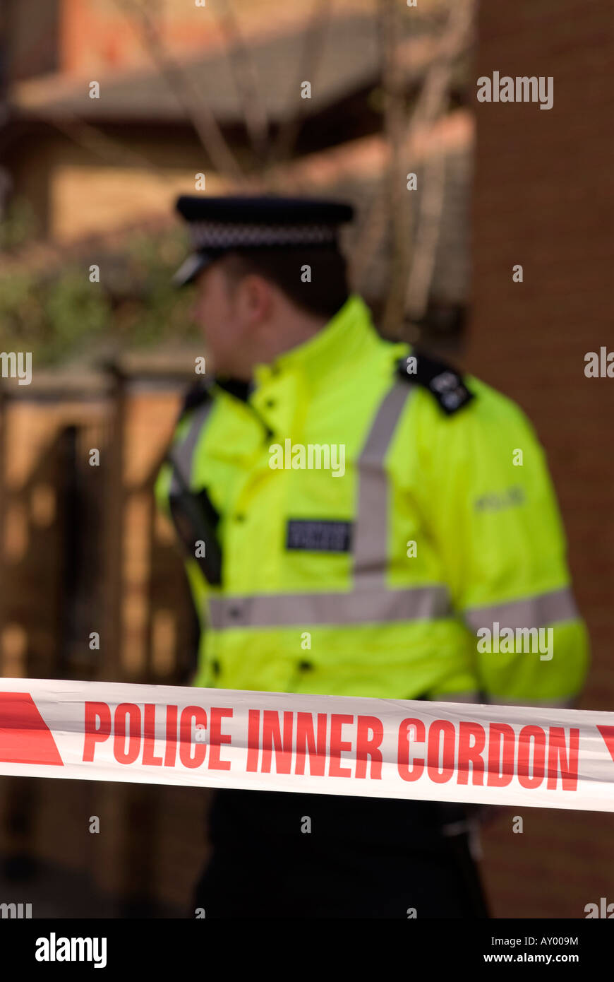 Police officer and cordon sign at the scene at a road traffic accident (RTA), Hounslow, Middlesex, UK. 30th March 2008 Stock Photo