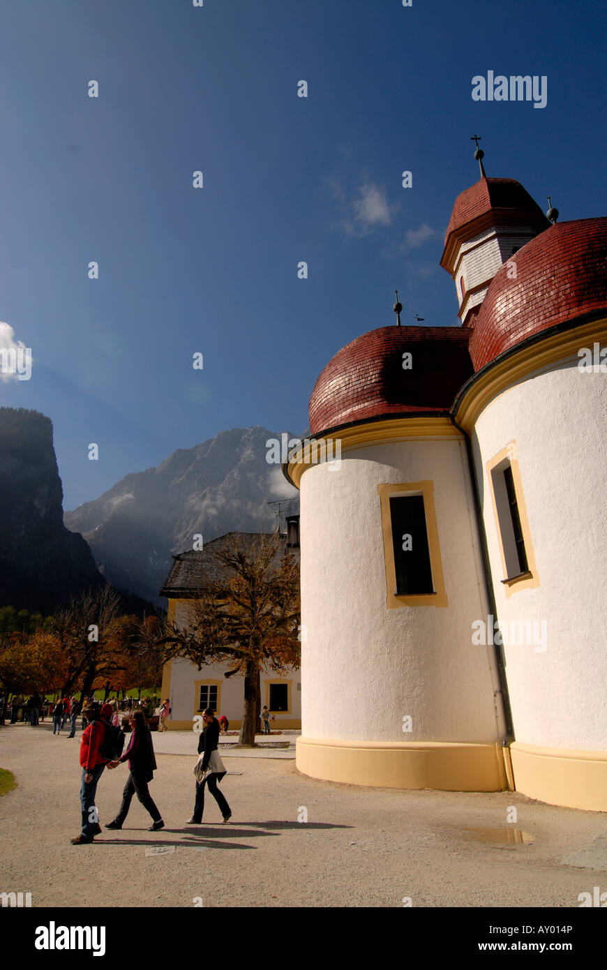 The very famous St Bartholomä church on the Königssee in the background the Watzman Berchtesgadener land National park Bavaria Stock Photo