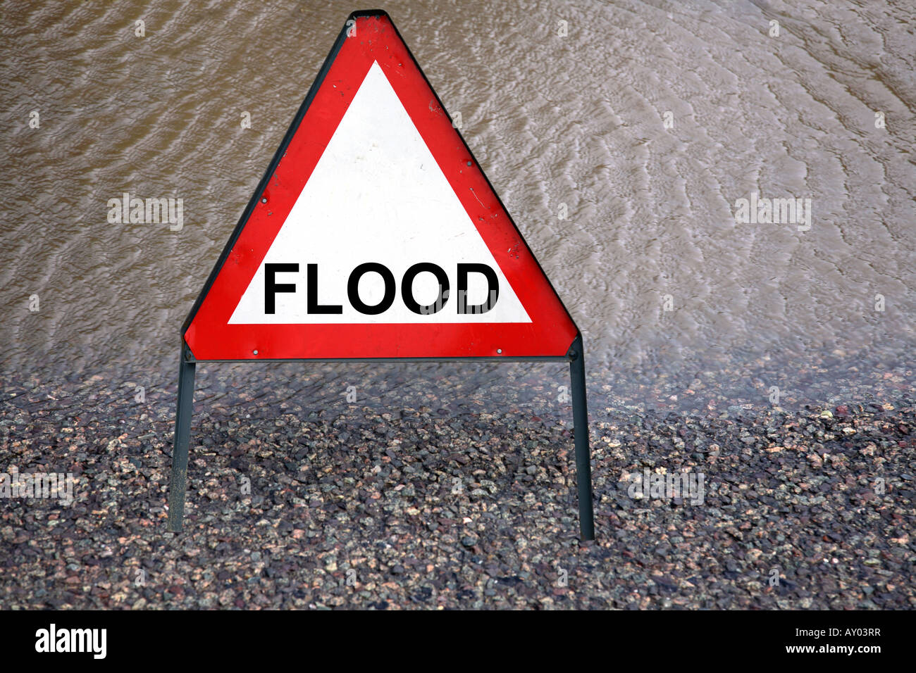 A flood sign on a flooded road. Stock Photo
