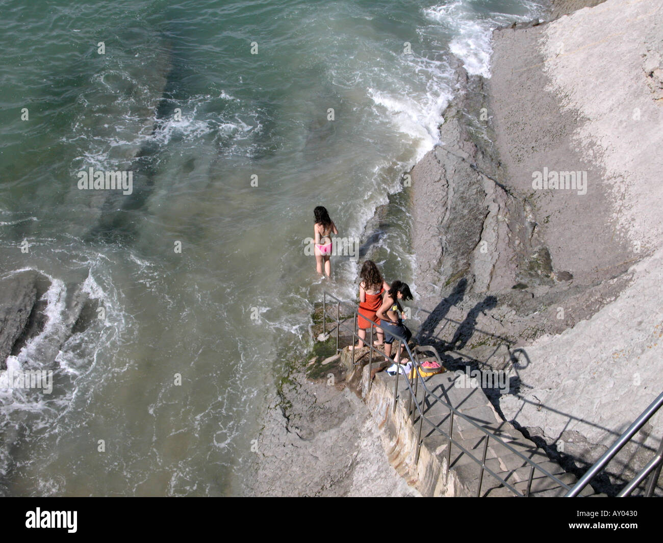 Bathing With Rocks Girls sunbathing in bikinis hi-res stock photography and images - Alamy