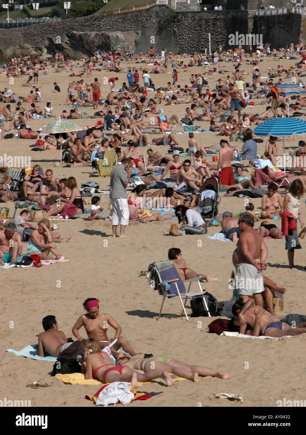 Sunbathers on the beach of Playa de Ondarreta San Sebastian in the Basque region Stock Photo