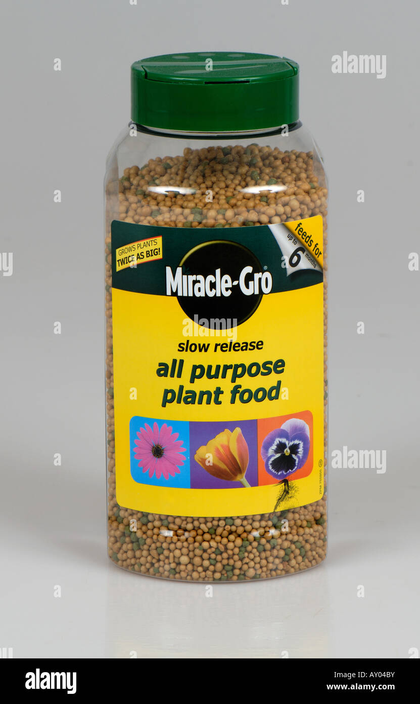 Plastic container of Miracle Grow slow release all purpose plant food granules Stock Photo