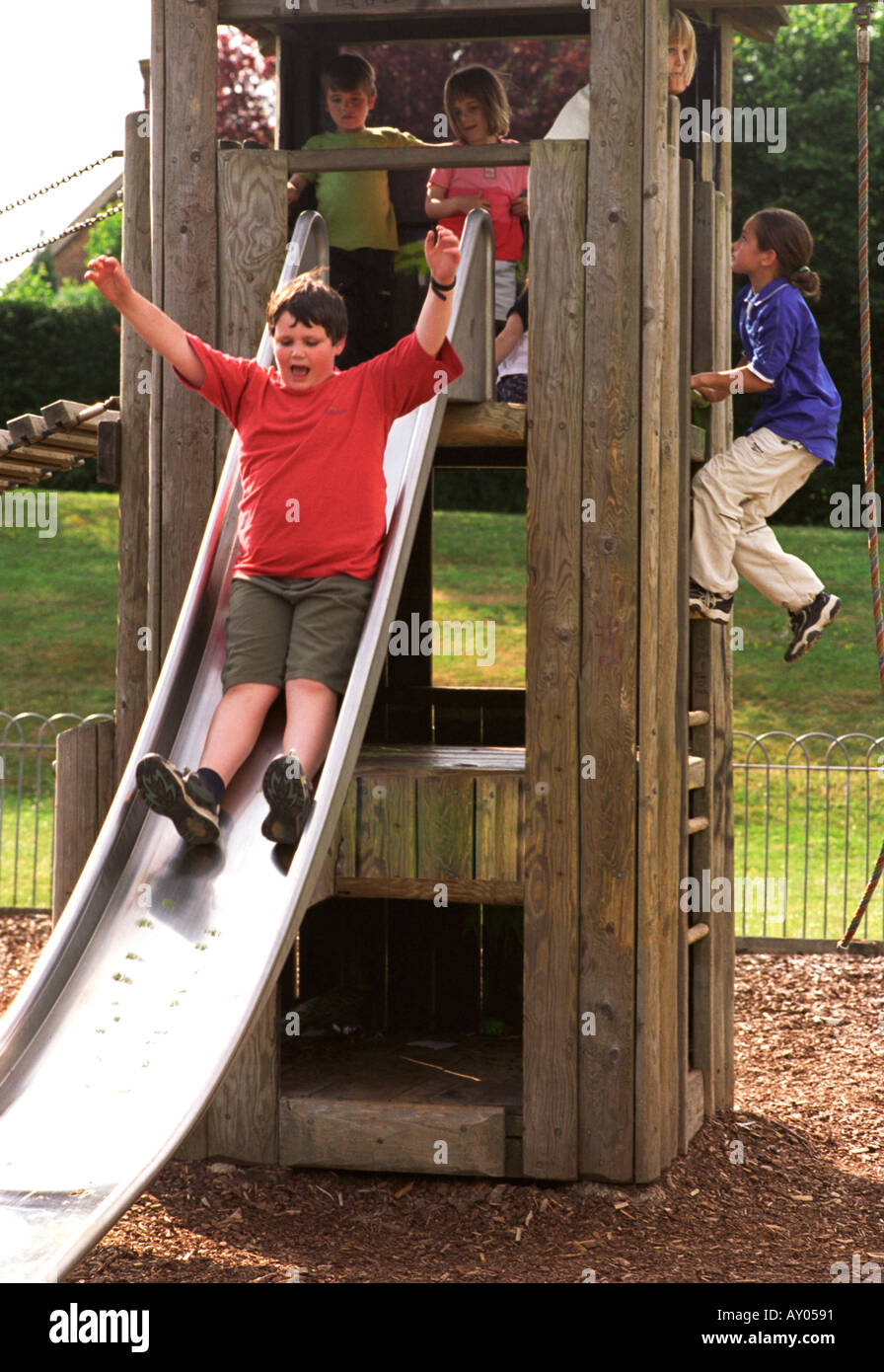 Sliding and climbing on playground apparatus Stock Photo Alamy