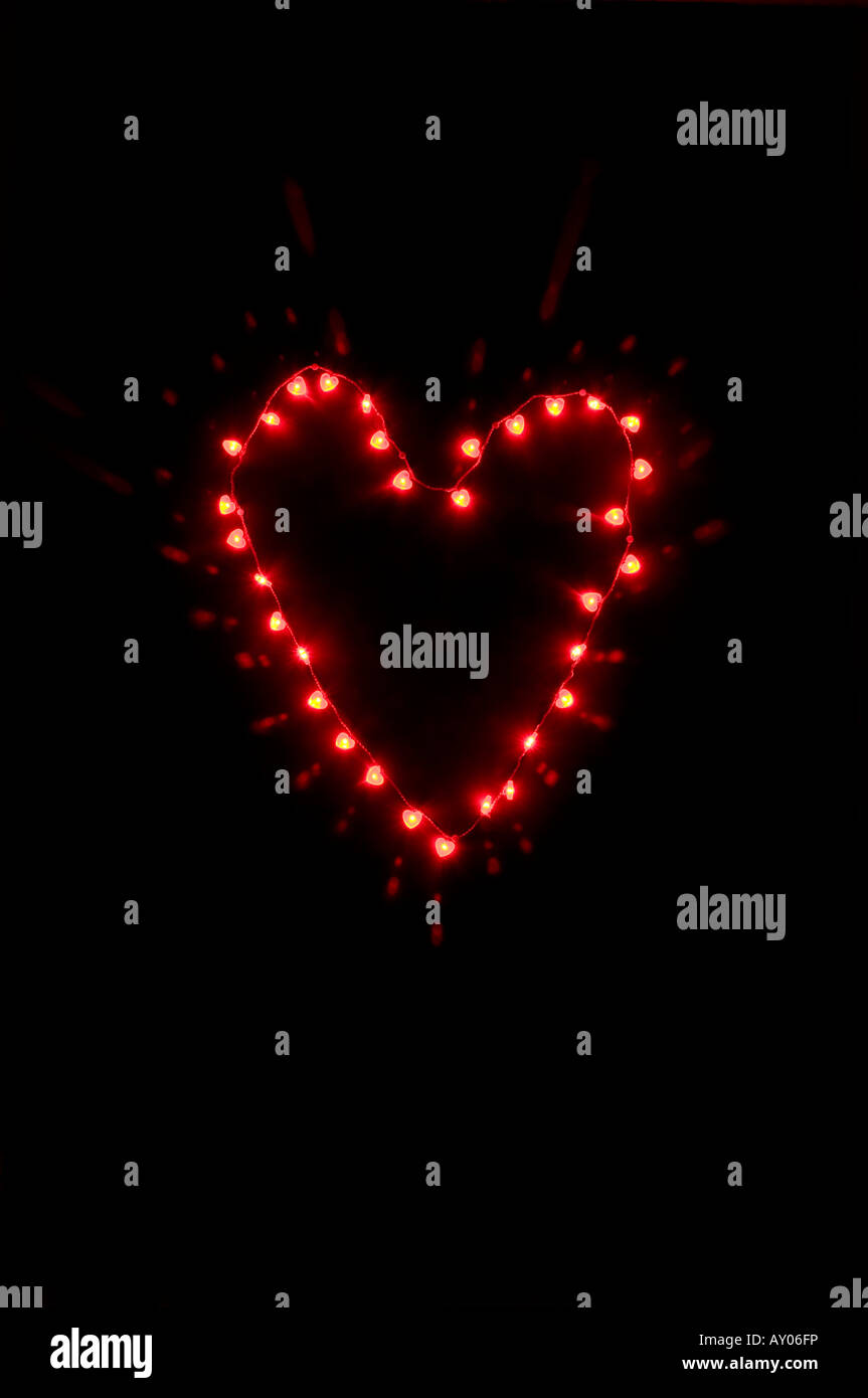 Small heart shape made of small heart shaped lights on black background