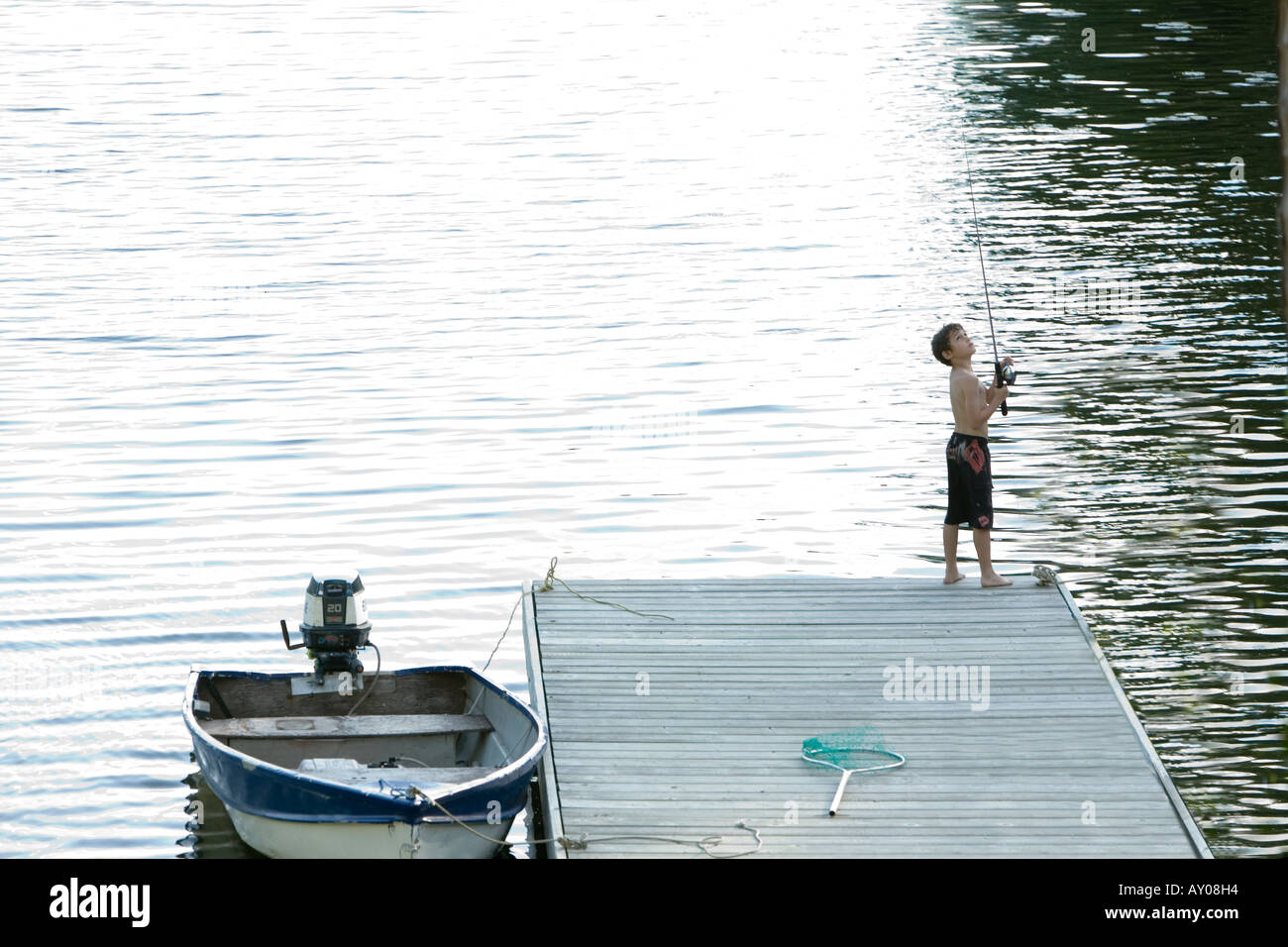Boy relaxing in fishing boat hi-res stock photography and images - Alamy