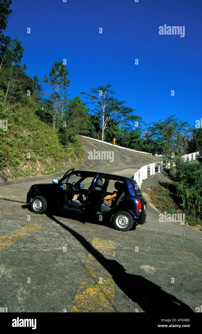 Car stopped at the bottom of the steepest road in Cuba Stock Photo