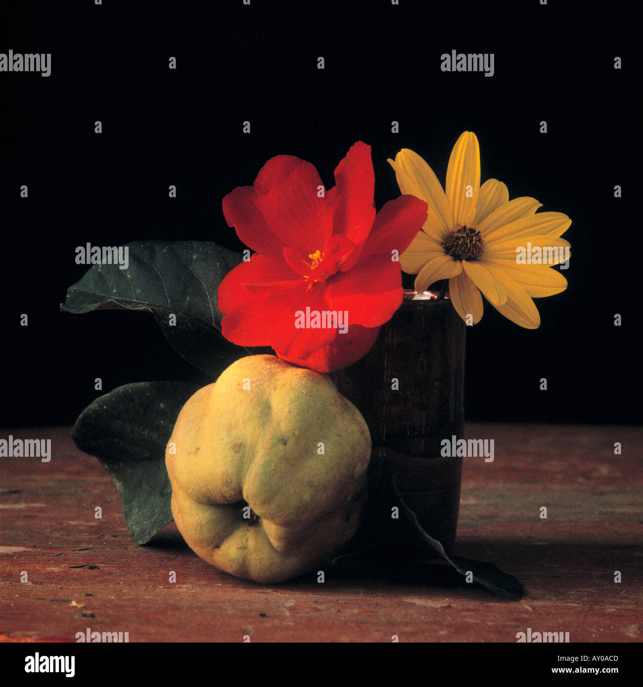 Still life with flowers and quince Stock Photo