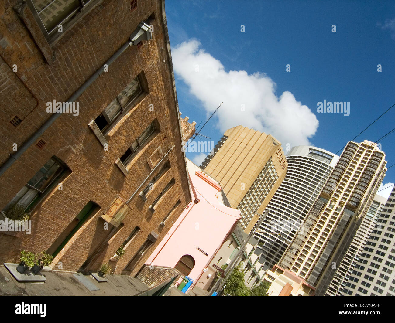 Old Cottages Against Backdrop Of Modern Tall Buildings The Rocks
