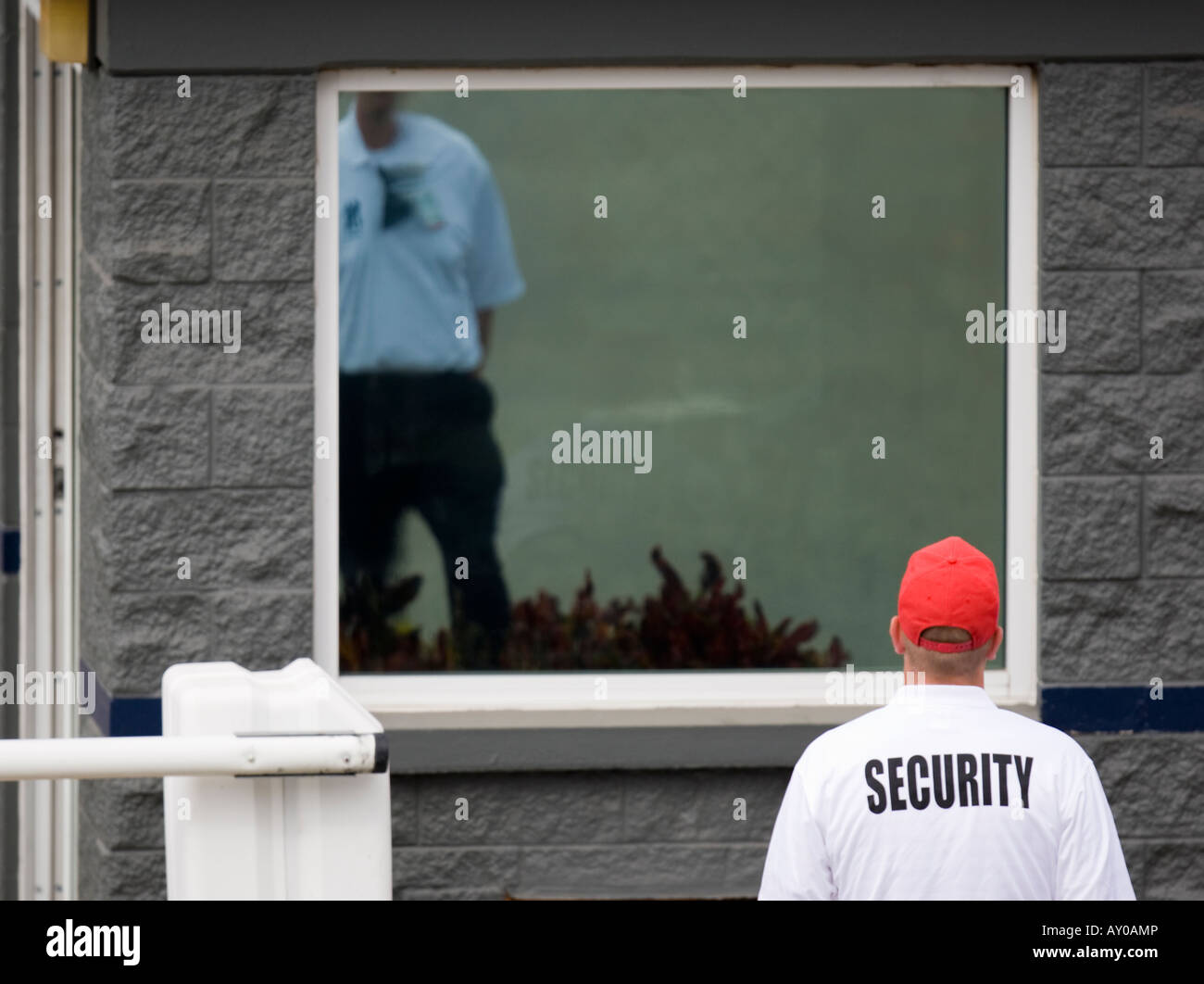 Guard at a security gate Stock Photo Alamy