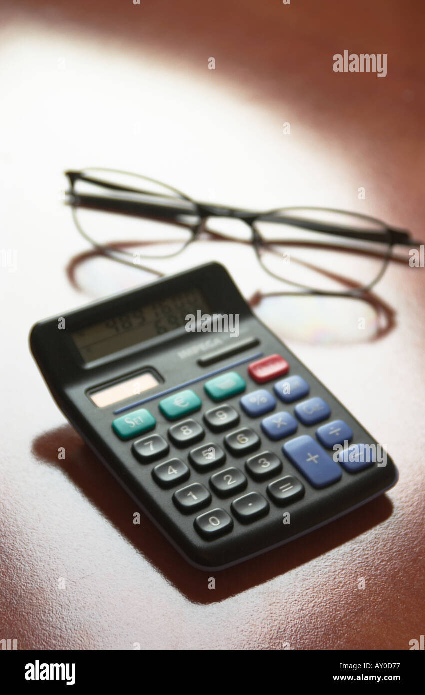 iconic view calculator and glasses Stock Photo