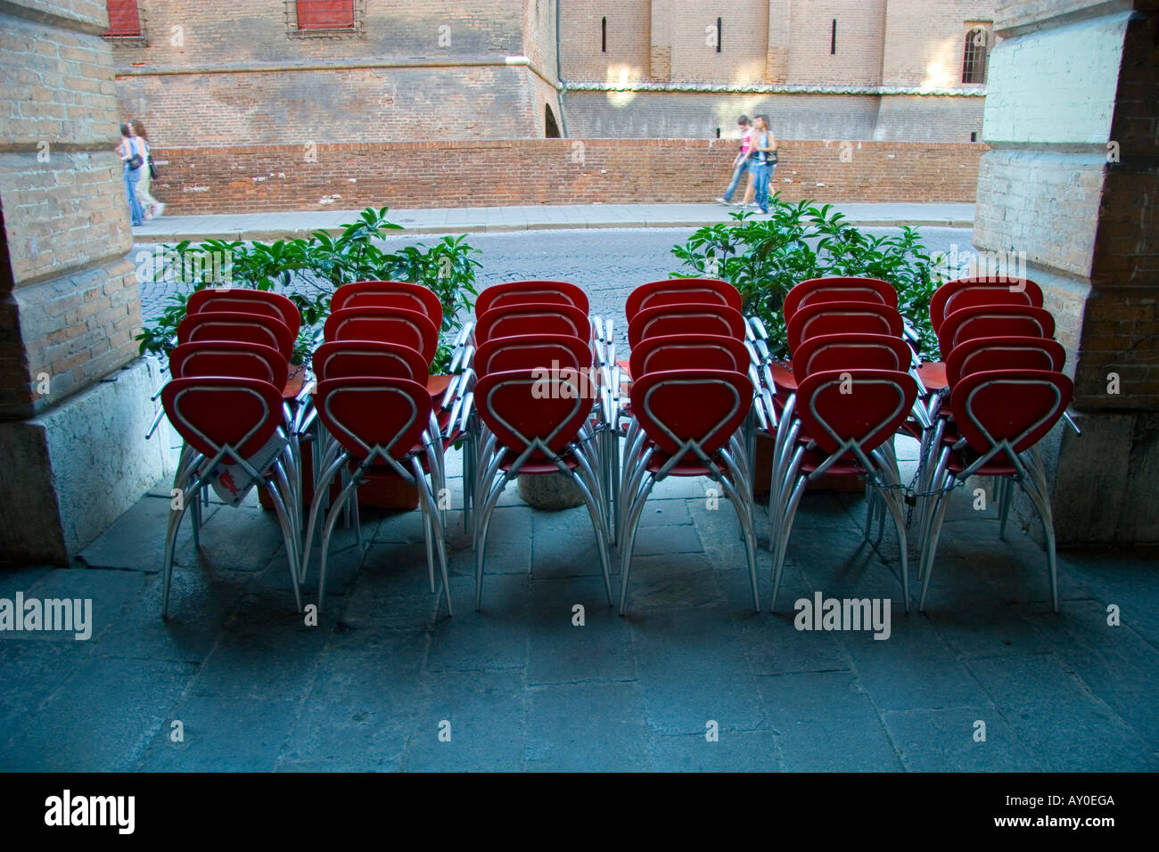 Ferrara, arcade, arch, column, castle, windows, clock, Este, chairs in