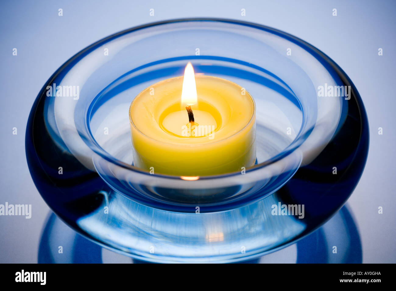 Candle in ashtray Stock Photo