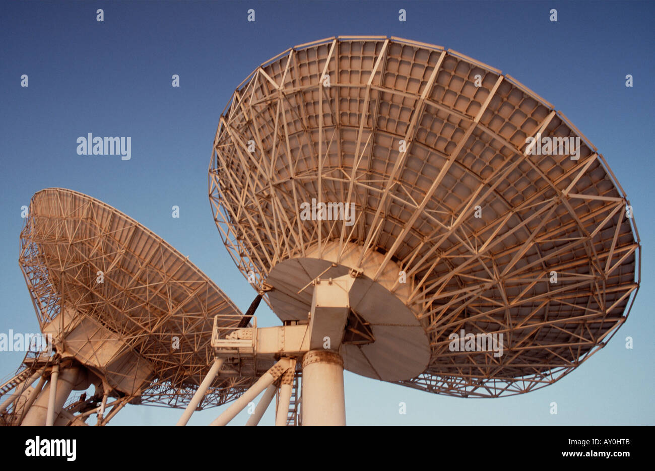 satellite radar dishes against a blue sky united arab emirates uae middle east Stock Photo Alamy
