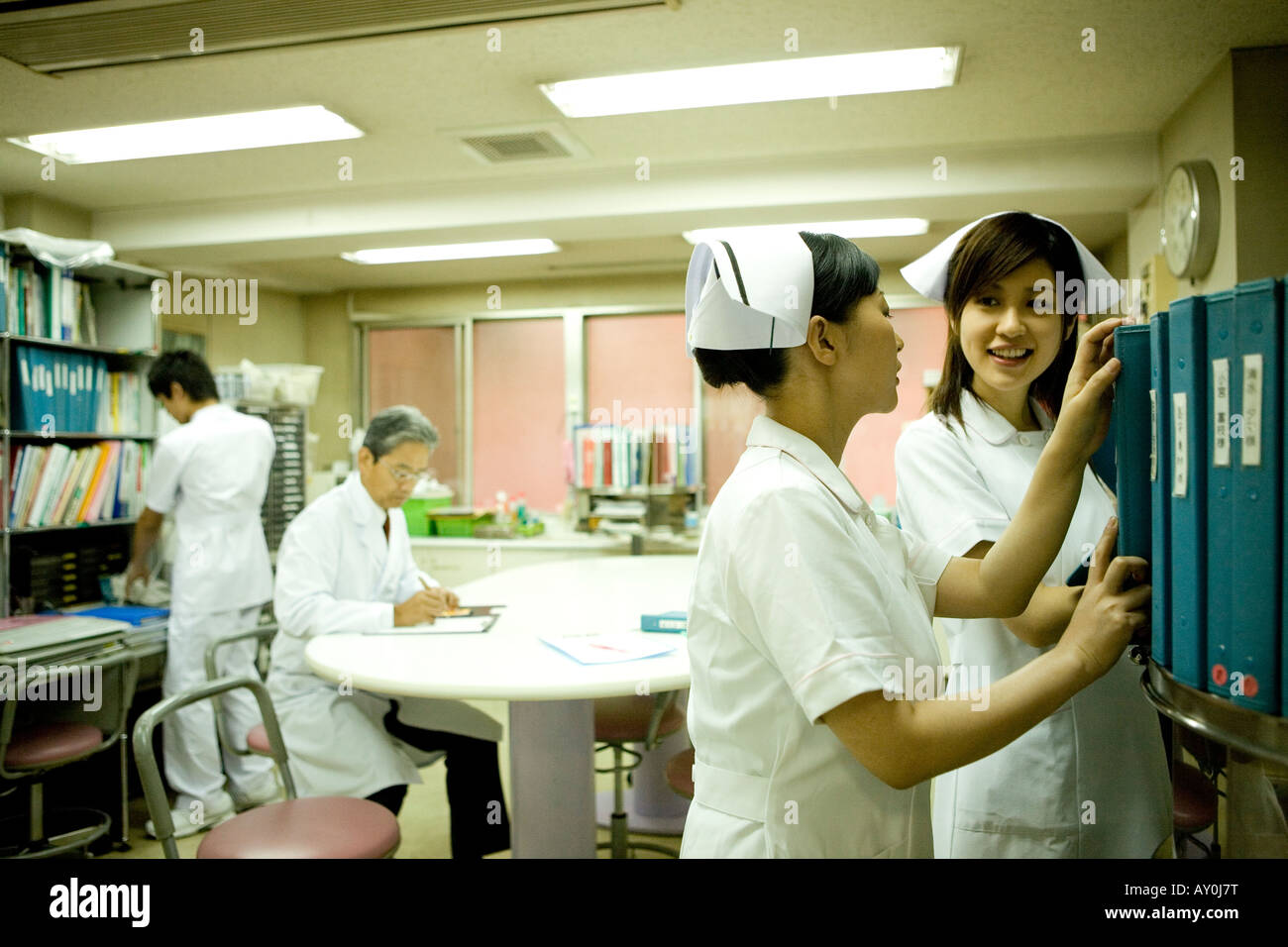 Doctor sand nurses working in nurses station Stock Photo