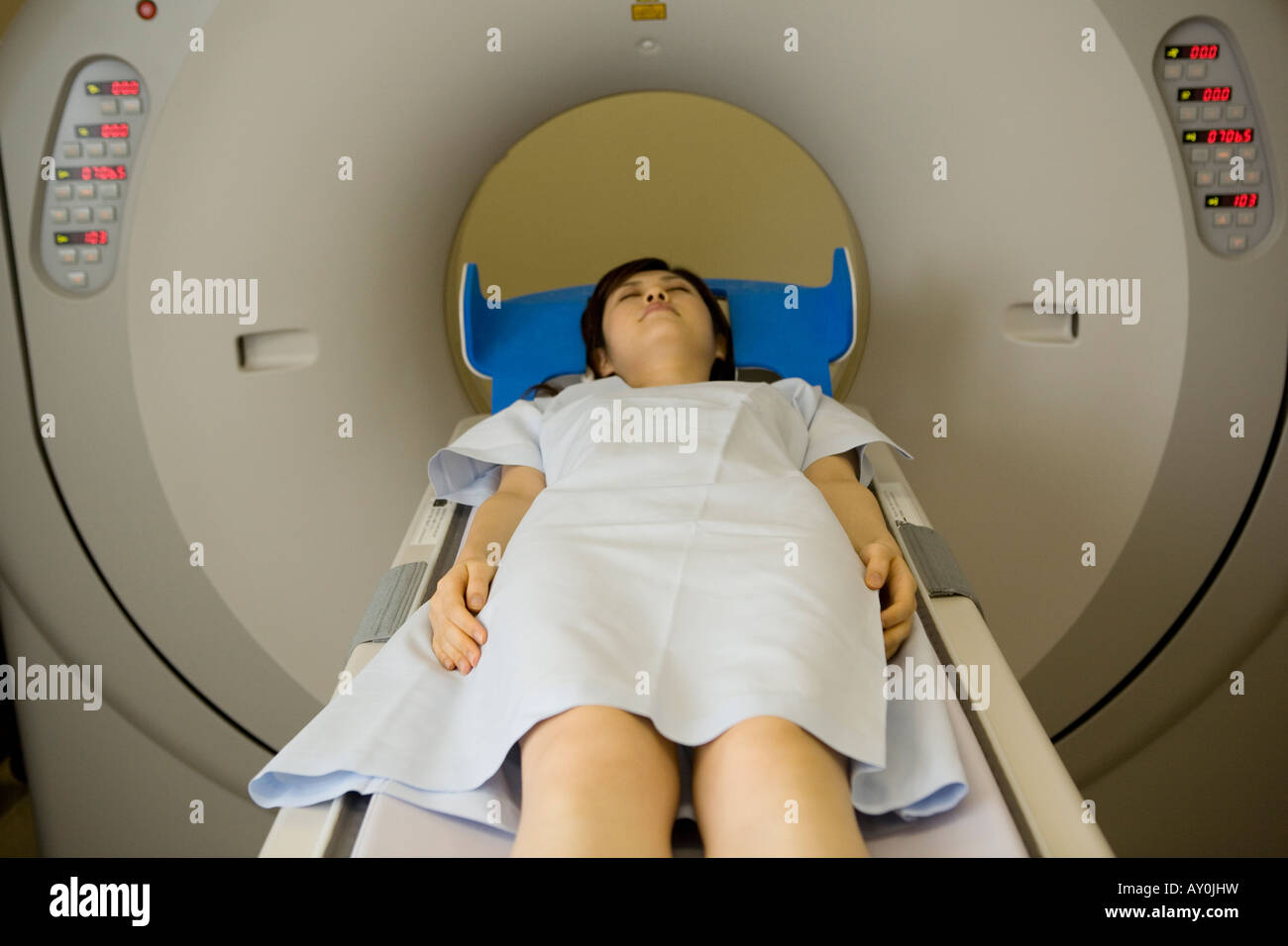 Young woman lying on  CAT Scan Stock Photo