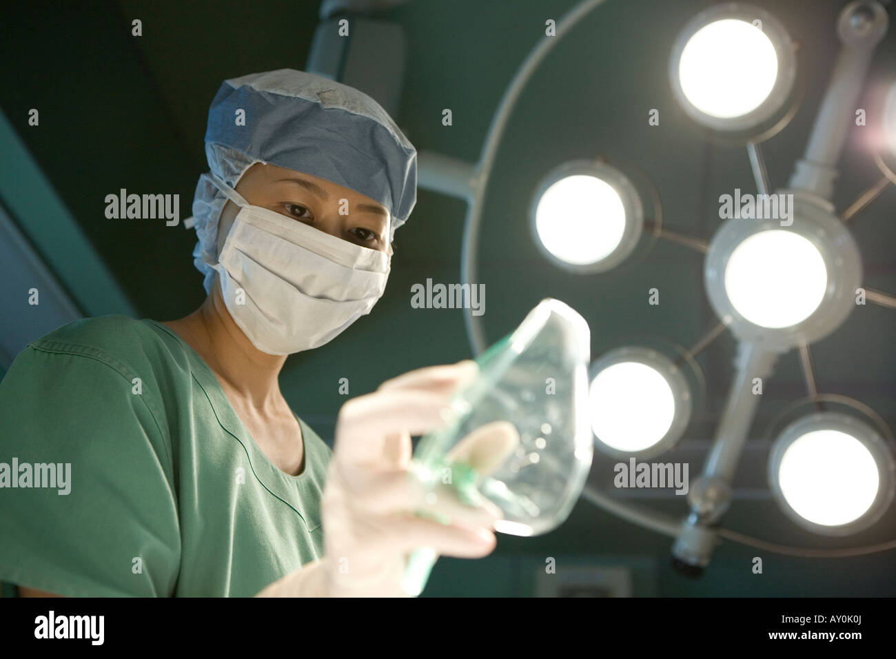 Nurse holding oxygen mask Stock Photo - Alamy