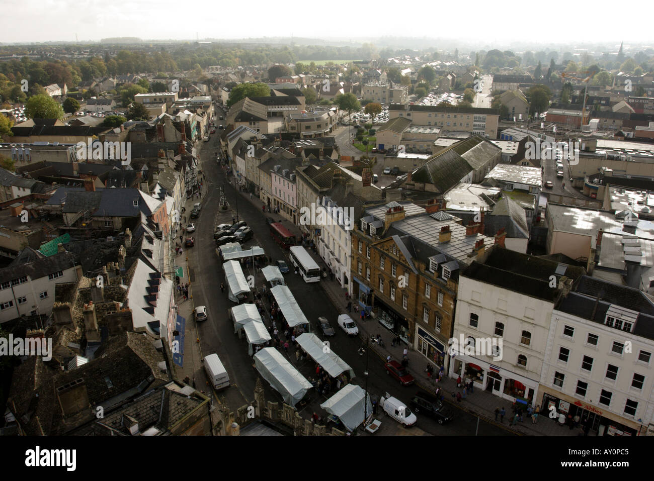 Aerial view of the town of Cirencester showing shops and the