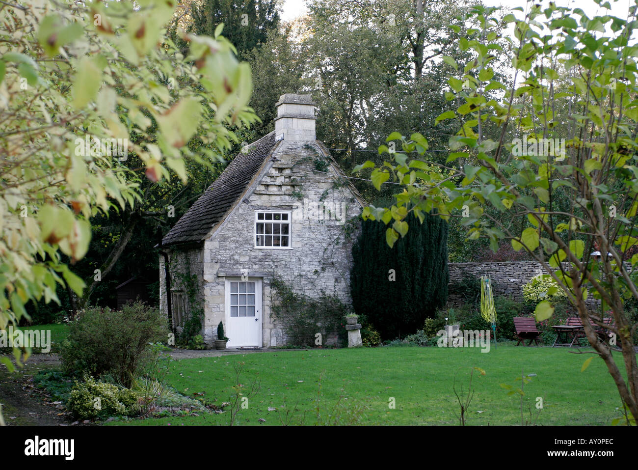 Cottage in grounds of larger house in Castle Combe Wiltshire Stock Photo Alamy