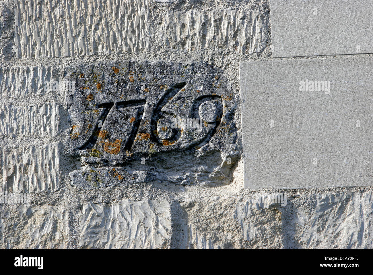 Date stone 1769 inset in reconstructed stone building Stock Photo