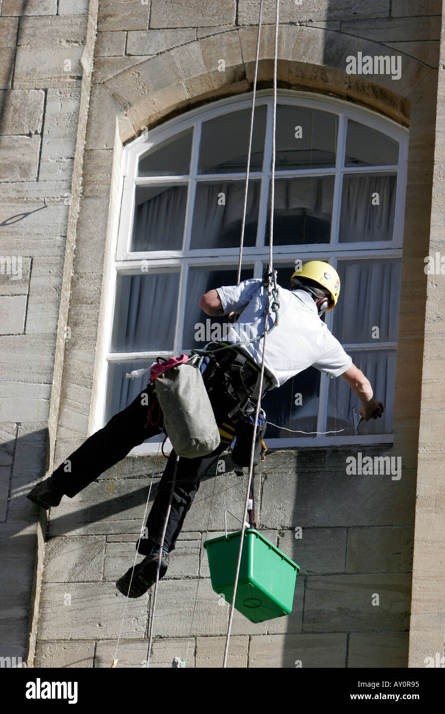 Window cleaners working on the windows of Abbey Mill recently converted