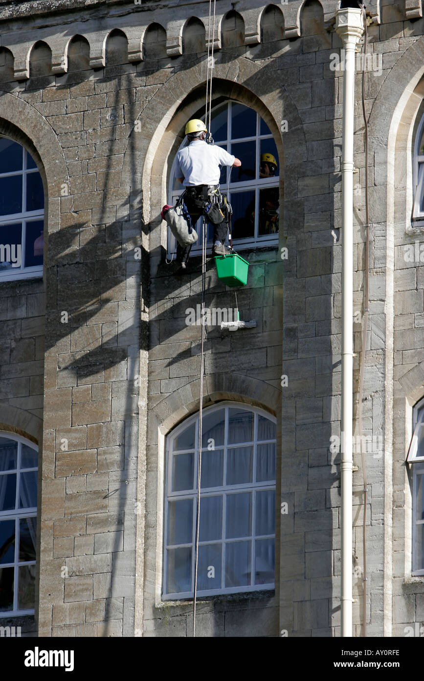 Window cleaners working on the windows of Abbey Mill recently converted