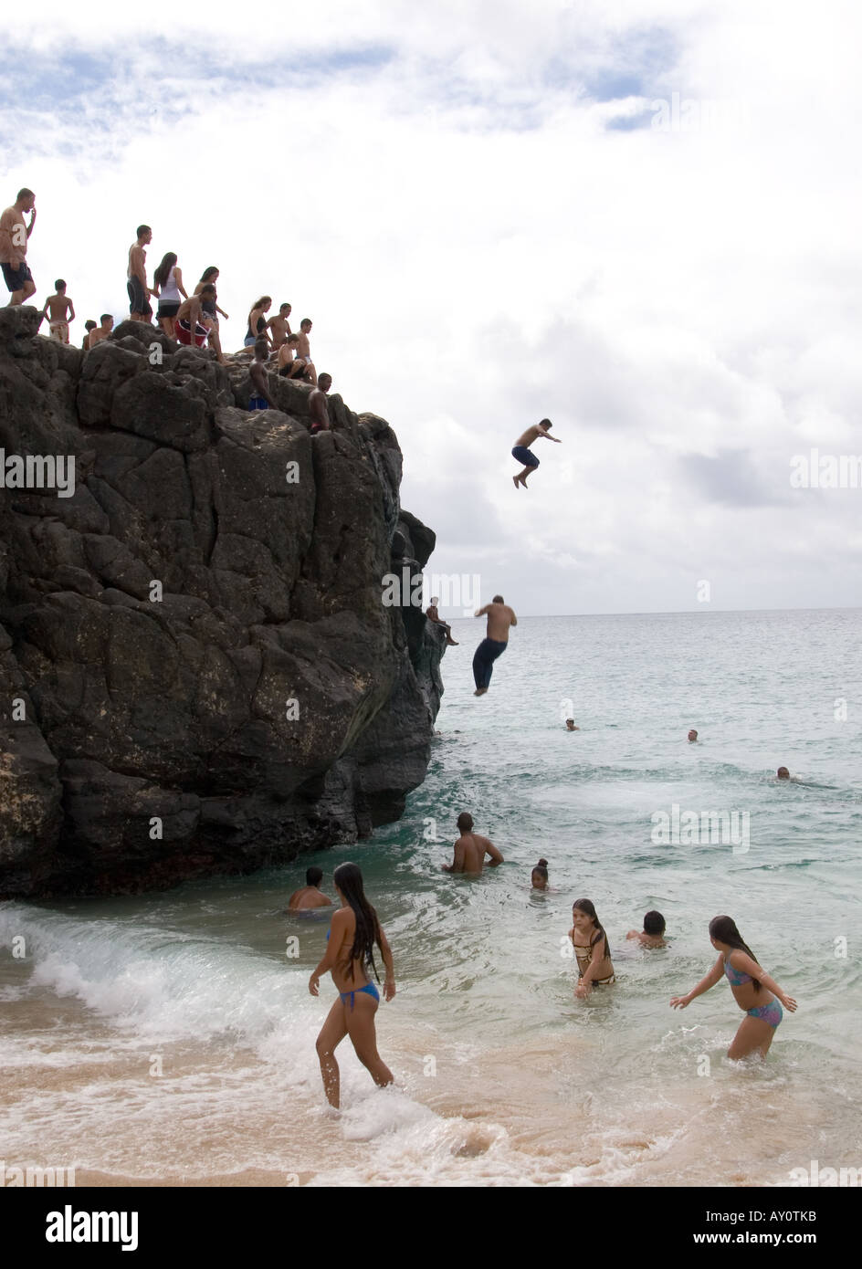 Jumping off the rock in Waimea Bay, Hawaii Stock Photo Alamy