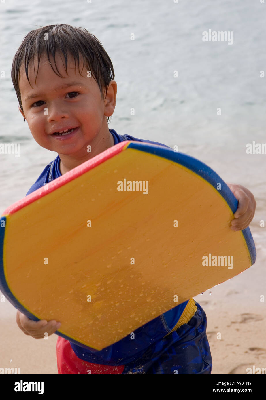 Toddler with a bodyboard (boogie board Stock Photo Alamy
