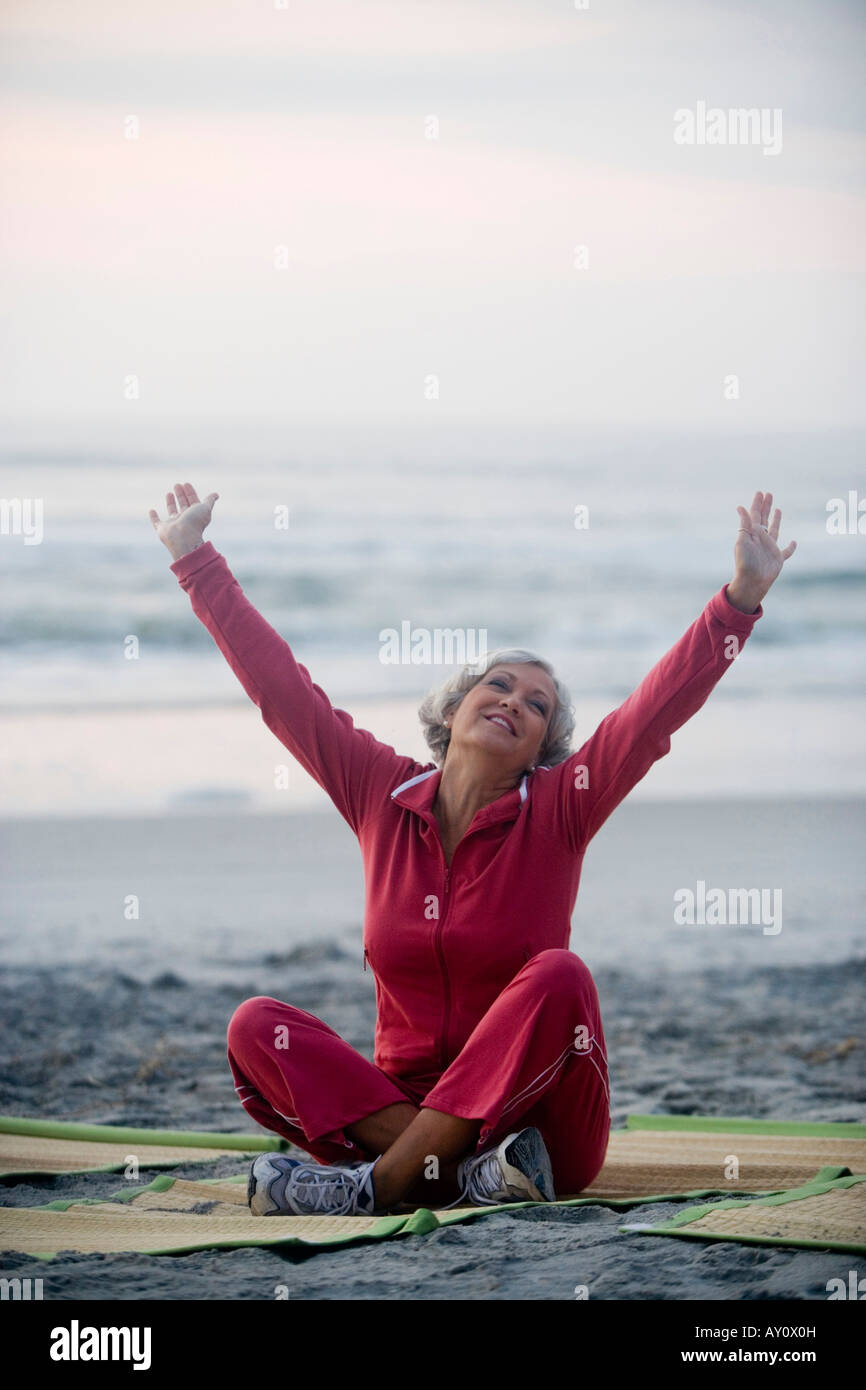 Mature woman relaxing at the beach Stock Photo - Alamy