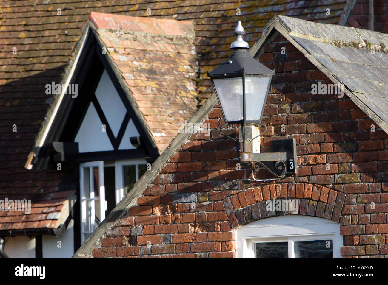 Red brick houses with dormer windows gable ends and a lantern Stock Photo