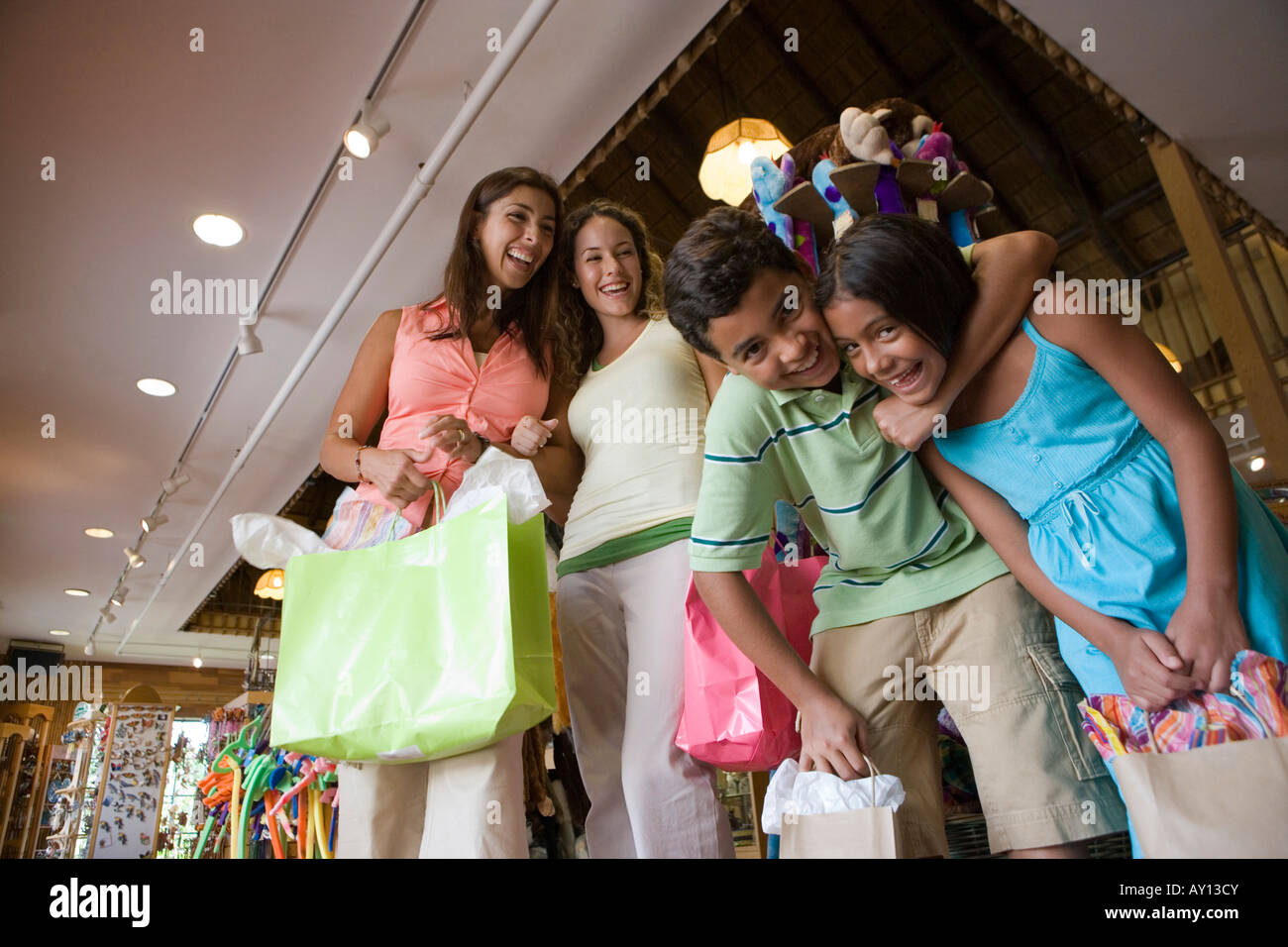 Portrait of people standing together in store Stock Photo - Alamy