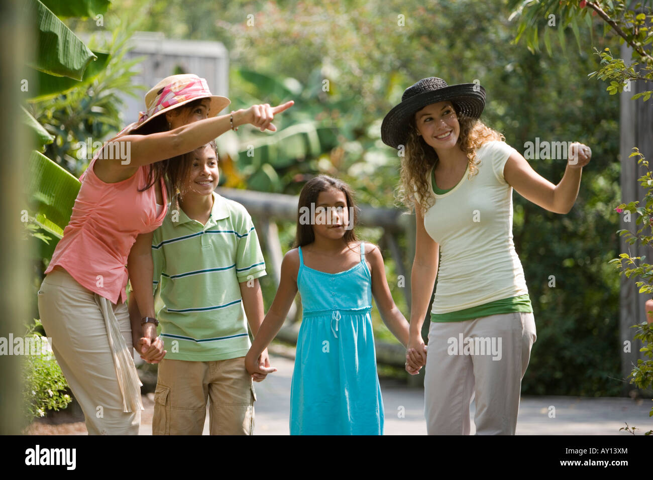 Young woman pointing while other looking up Stock Photo - Alamy