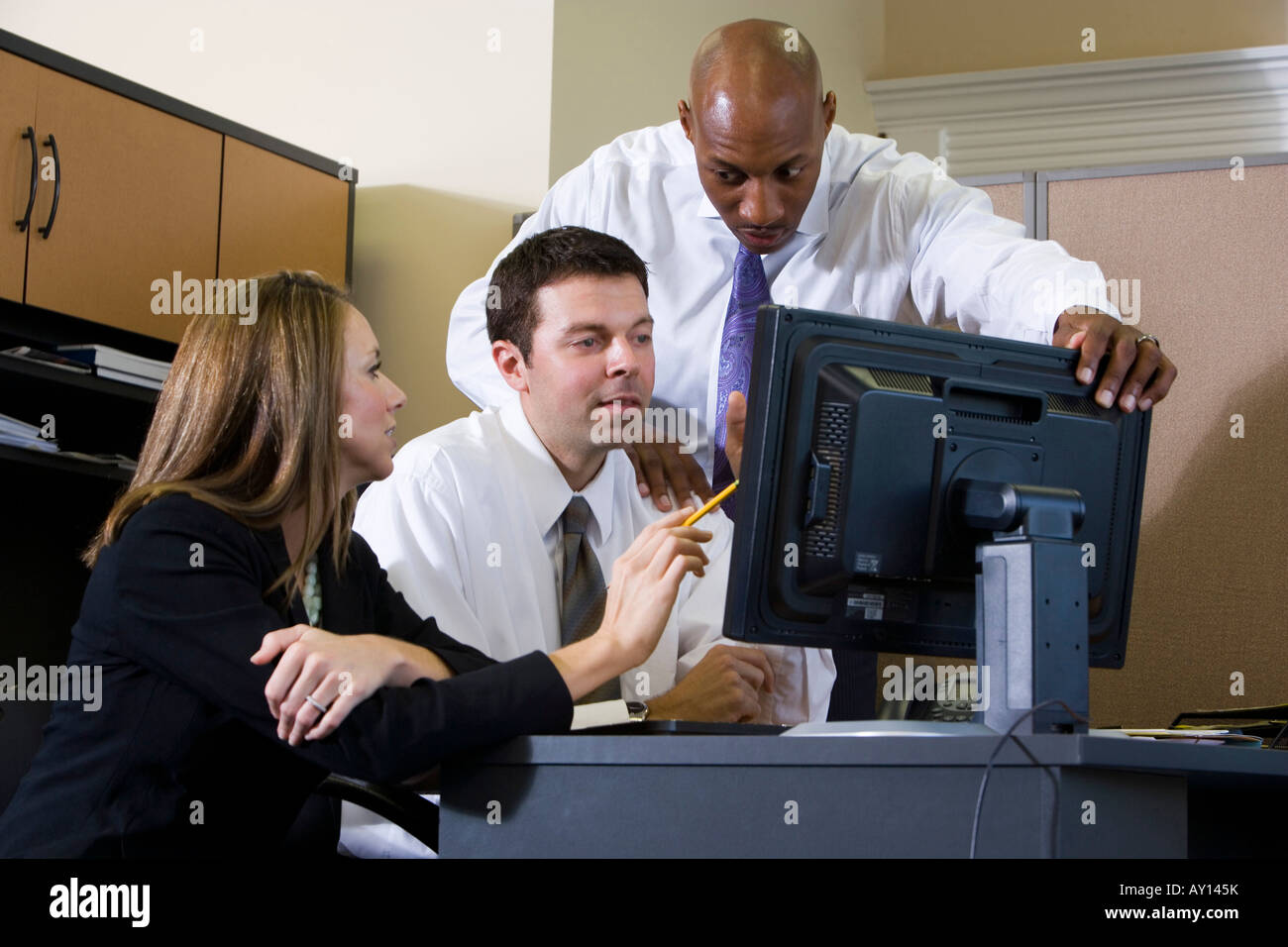 Business people using computer in an office Stock Photo - Alamy