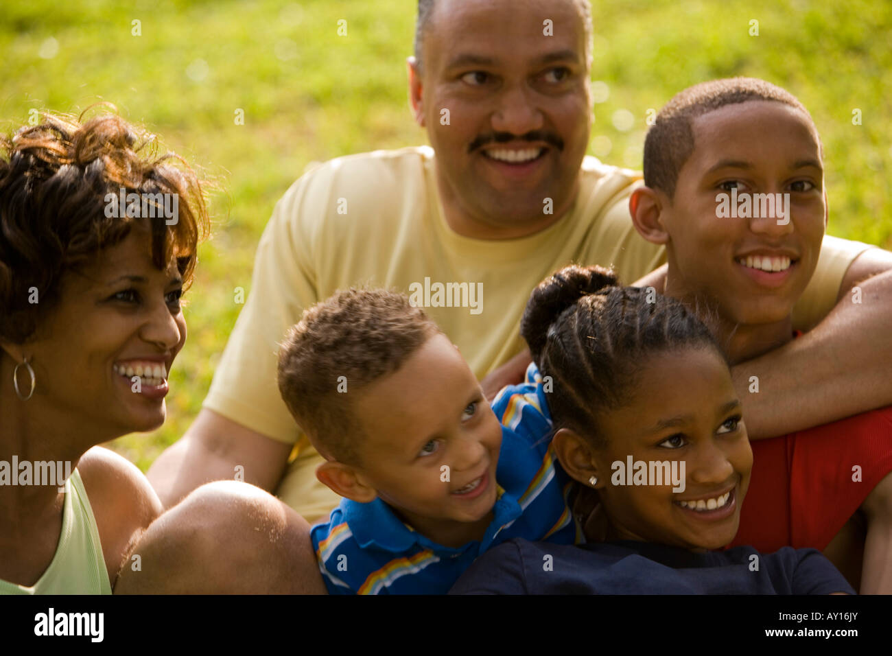 parents-smiling-with-their-children-at-park-stock-photo-alamy