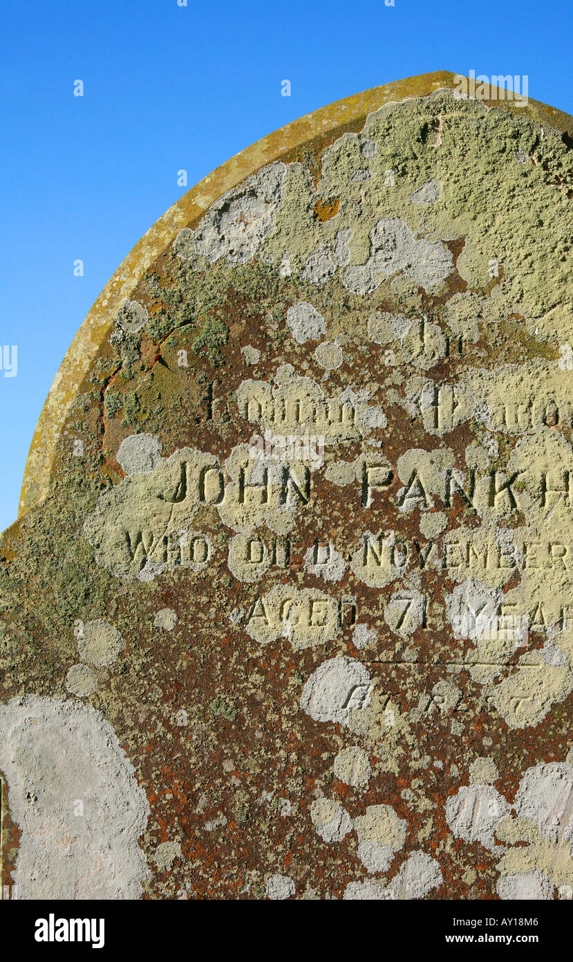 Lichen covered gravestone detail in an English country churchyard Stock Photo