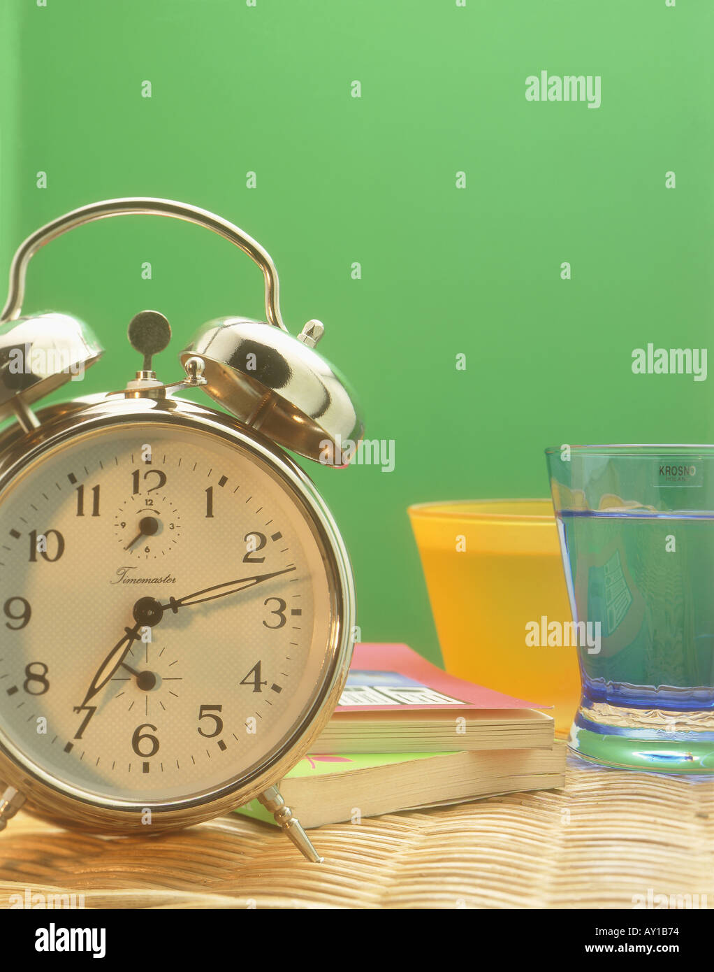 Alarm Clock on Bedside Table Stock Photo