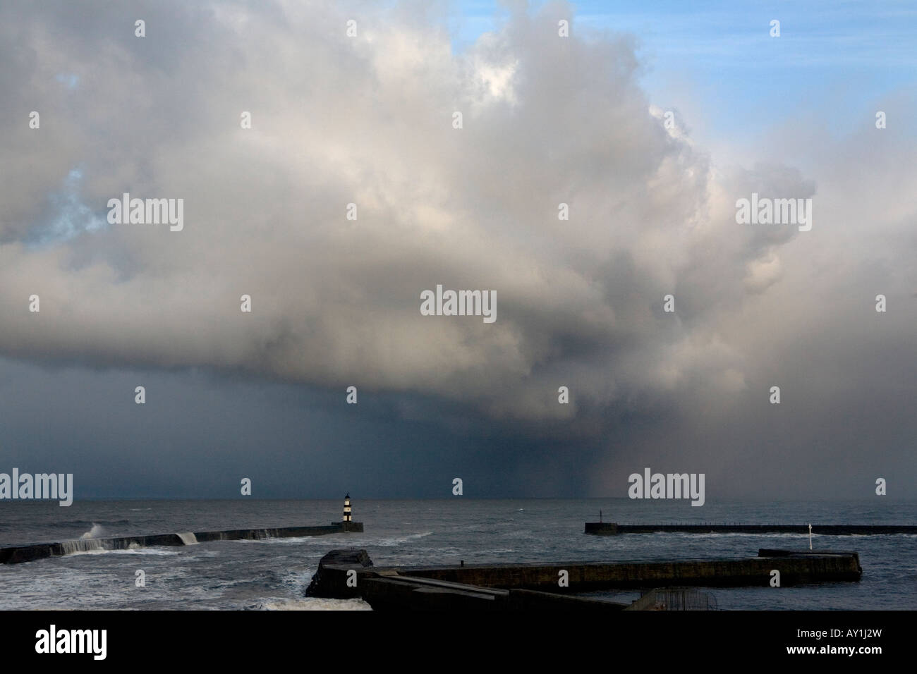 A snow storm over Seaham Pier and harbour in County Durham during a spring storm. England, UK Stock Photo