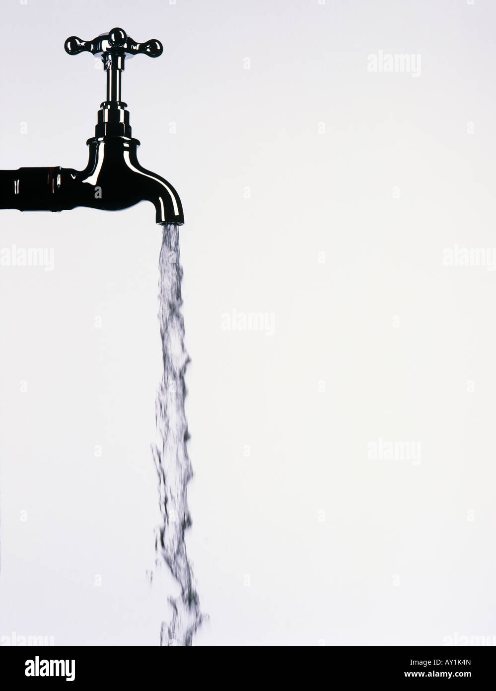 Tap with water flowing from it Stock Photo