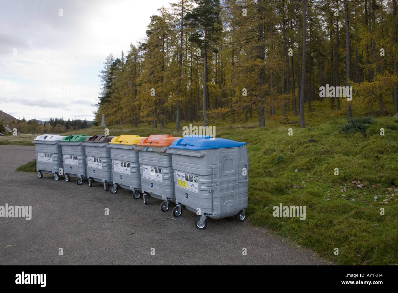Wheelie bin. New metal recycling bins, paper reuse, plastic recycle in remote rural woodland car park, Braemar, Cairngorms National Park, Scotland UK. Stock Photo
