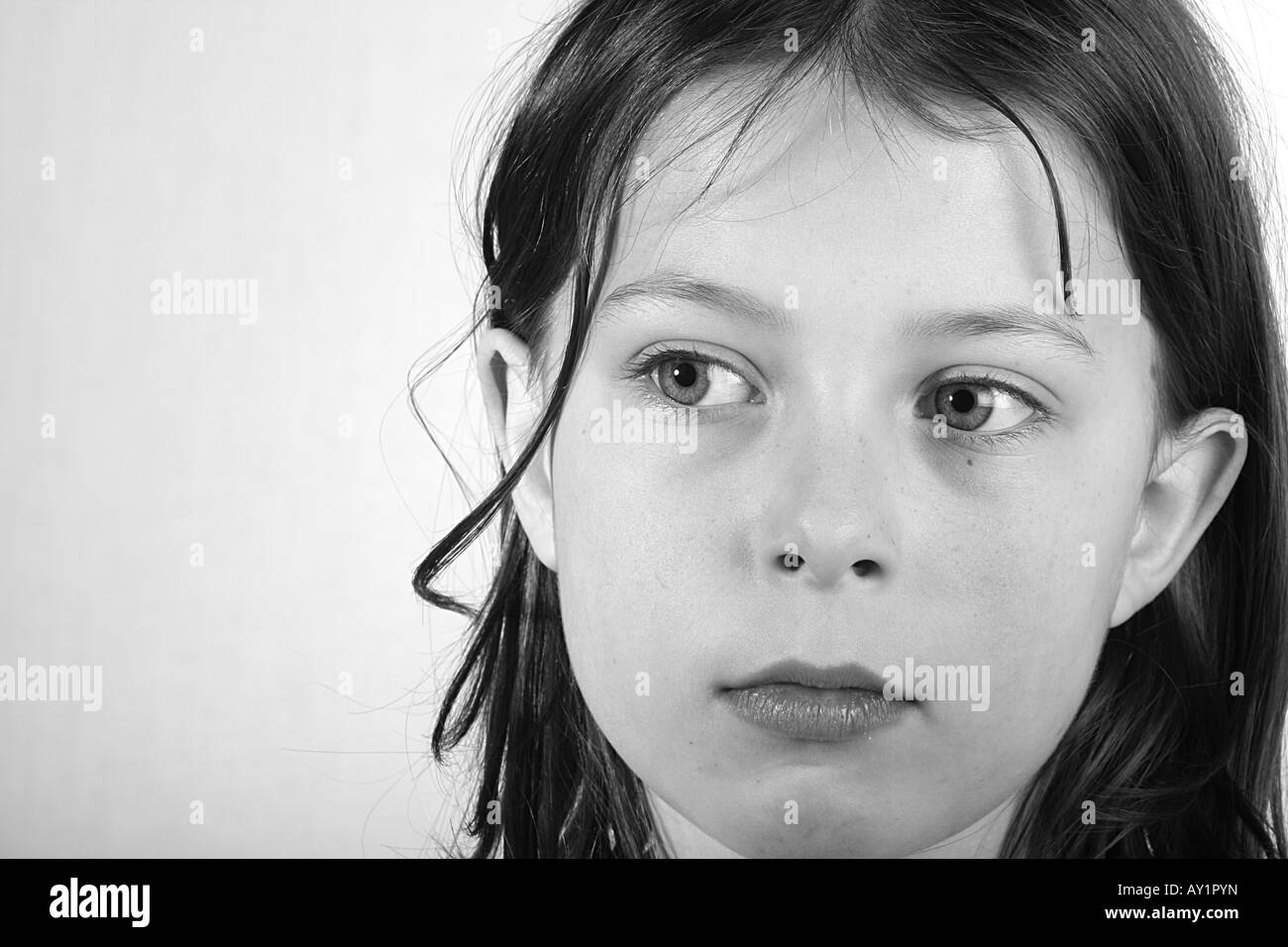 Pretty Young Girl Close Up against a Light Background Stock Photo