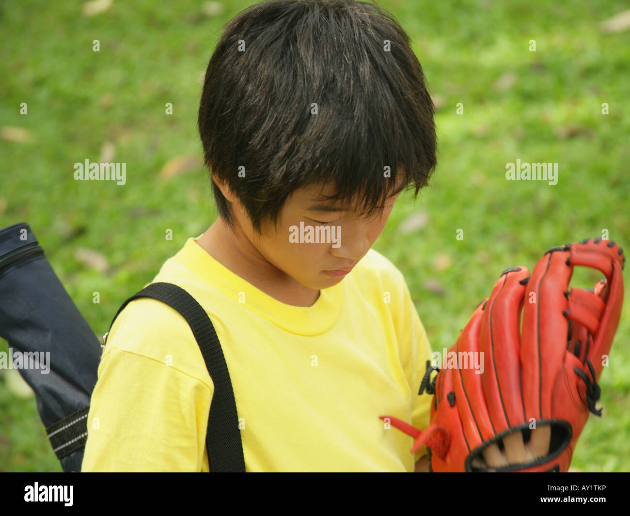 Closeup of a boy wearing baseball gloves Stock Photo Alamy