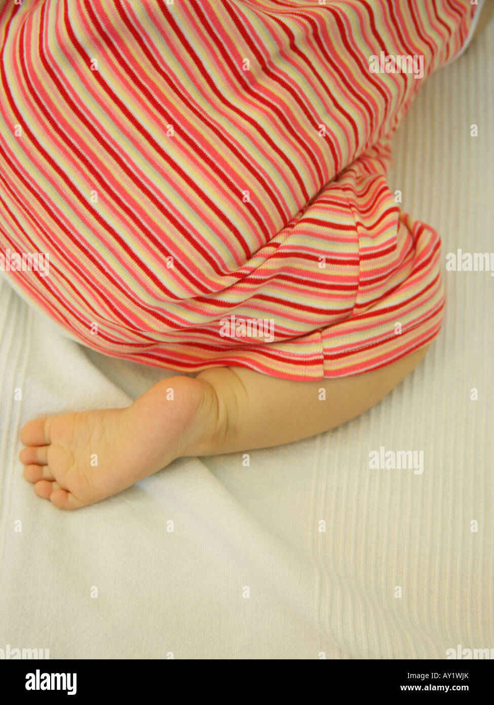 Closeup of a baby girl kneeling Stock Photo Alamy