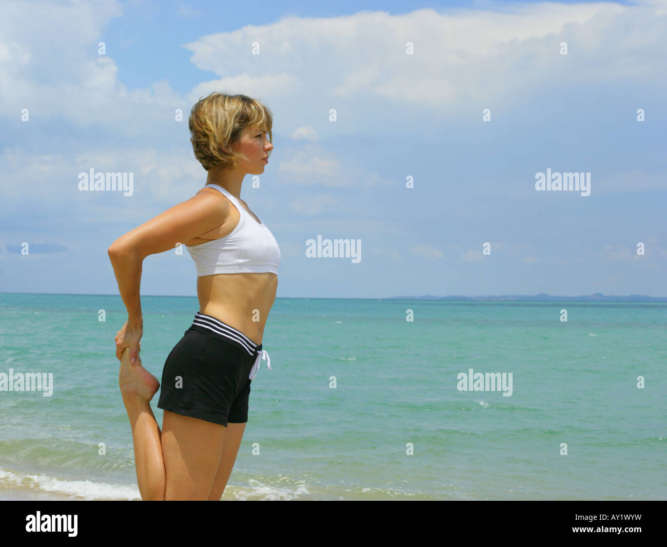 Beach Rode Side Profile Side profile of a young woman exercising on the beach Stock Photo - Alamy