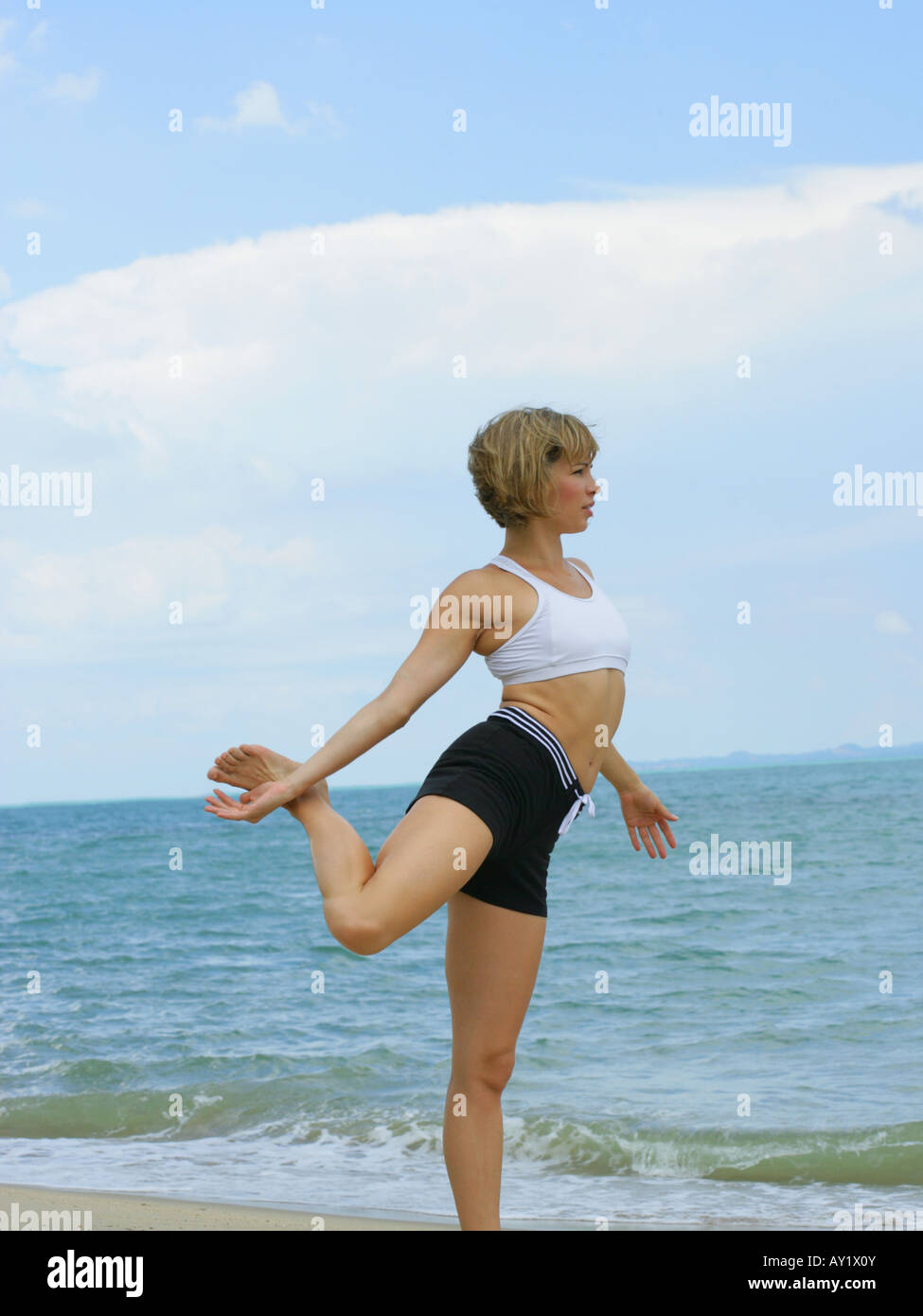Beach Rode Side Profile Side profile of a young woman exercising on the beach Stock Photo - Alamy