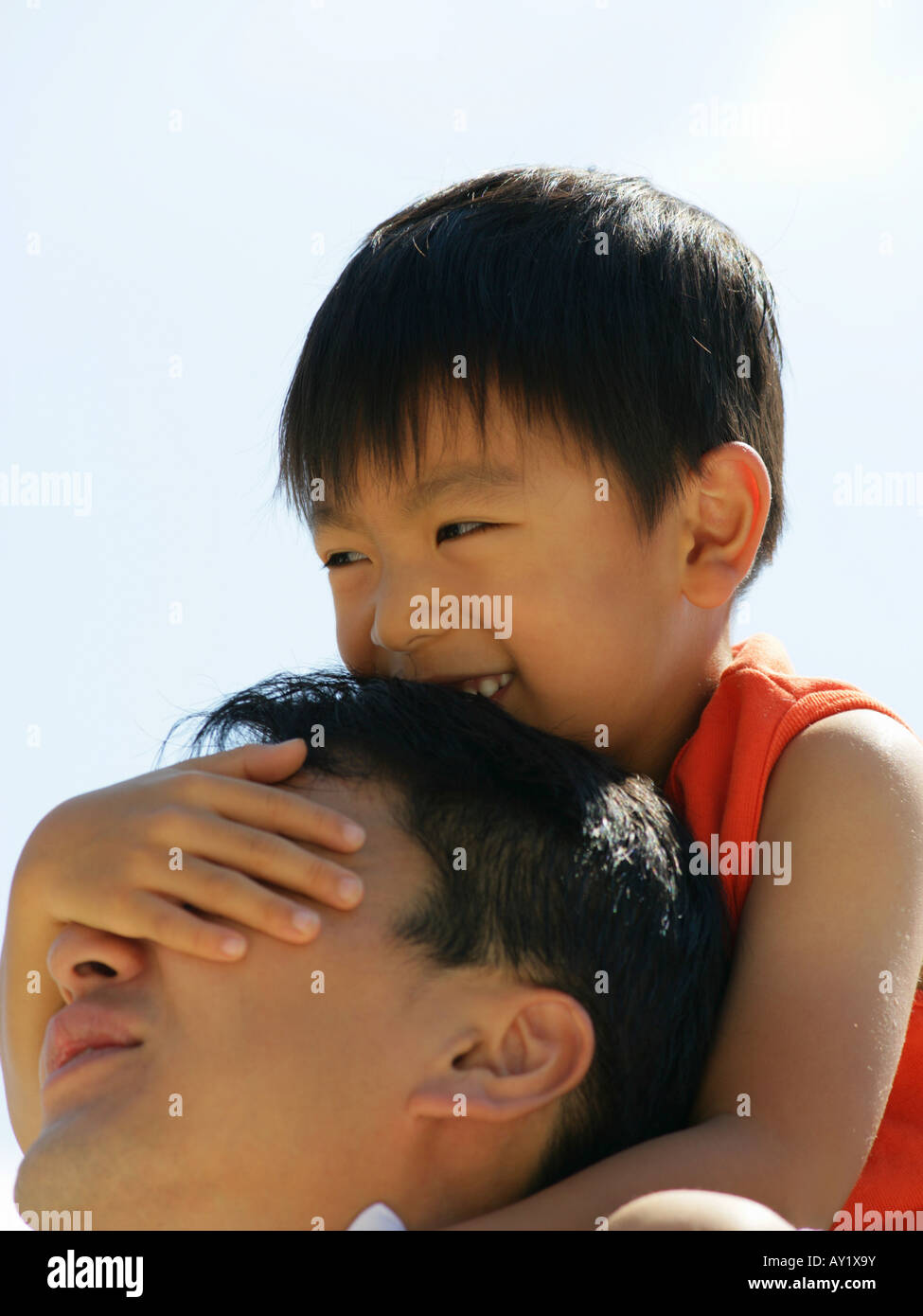 Close-up of a father carrying his son on his shoulders Stock Photo - Alamy