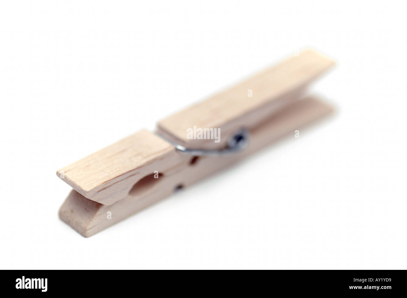 Wooden peg used on washing lines on white background Stock Photo Alamy