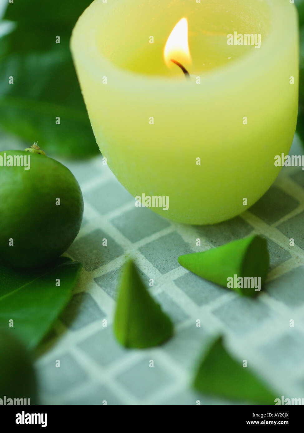 Close-up of a lit candle with incense Stock Photo
