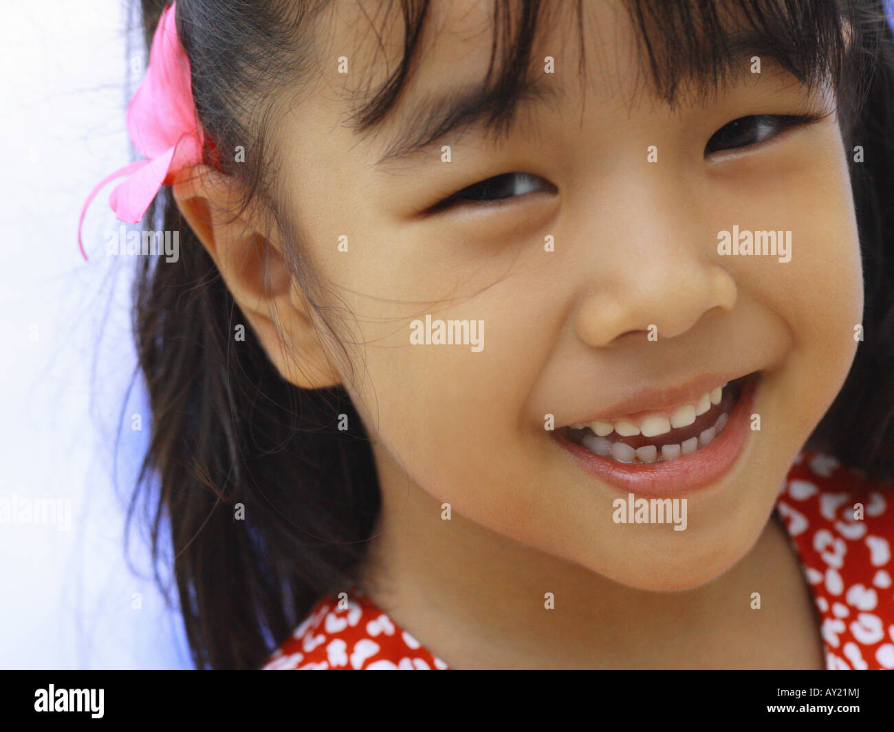 Portrait of a girl looking cheerful Stock Photo - Alamy