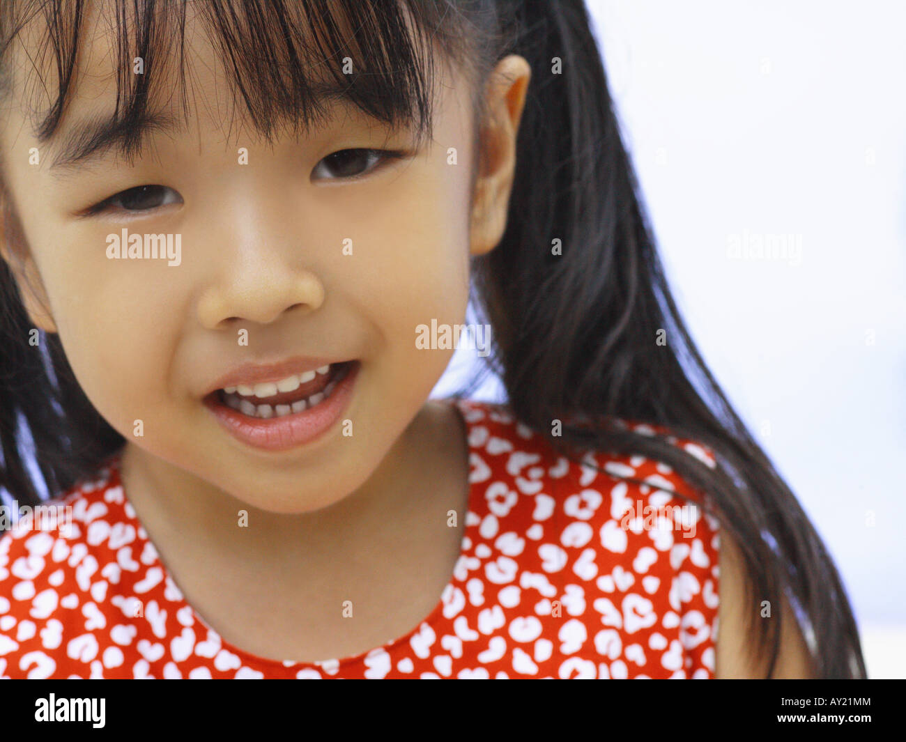 Portrait of a girl looking cheerful Stock Photo - Alamy